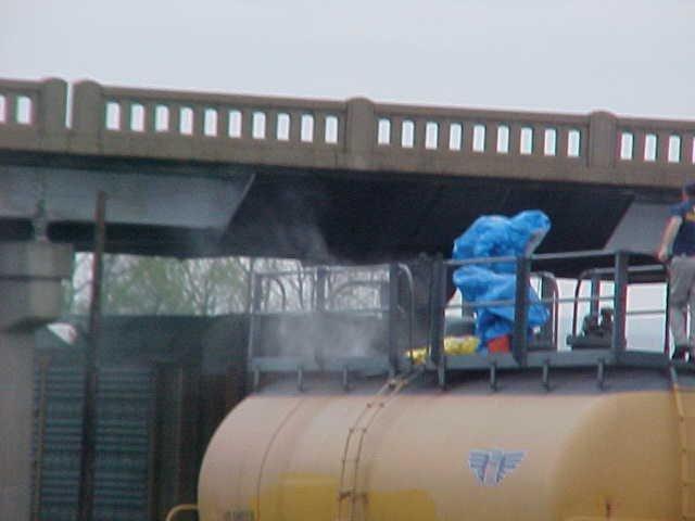 Fire fighter learning how to work on a dangerous rail car.